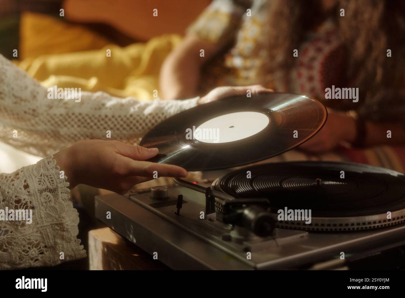 Spinning Vinyl Record on Turntable in Cozy Setting Stock Photo - Alamy