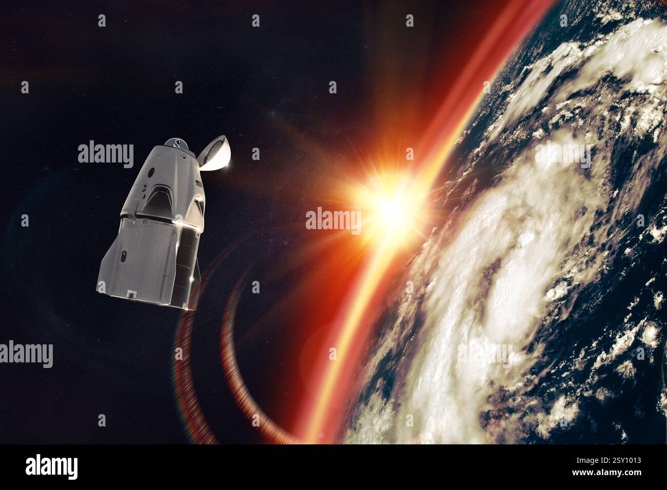 Cargo spacecraft in Earth orbit with sun rays. Elements of this image ...