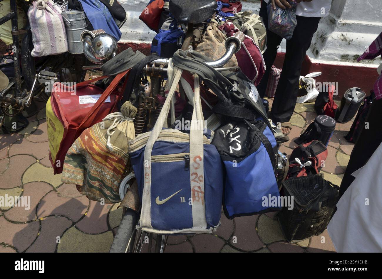 Dabbawalas carrying lunchbox on cycle at mumbai maharashtra India Stock Photo