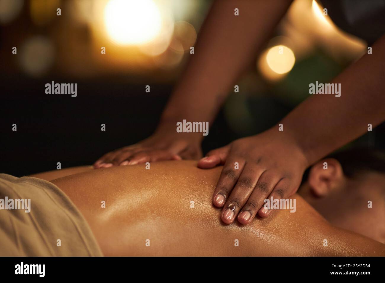 Close-up of hands giving massage in a calming environment, smooth, gentle strokes relaxing muscles, creating a serene atmosphere perfect for unwinding Stock Photo