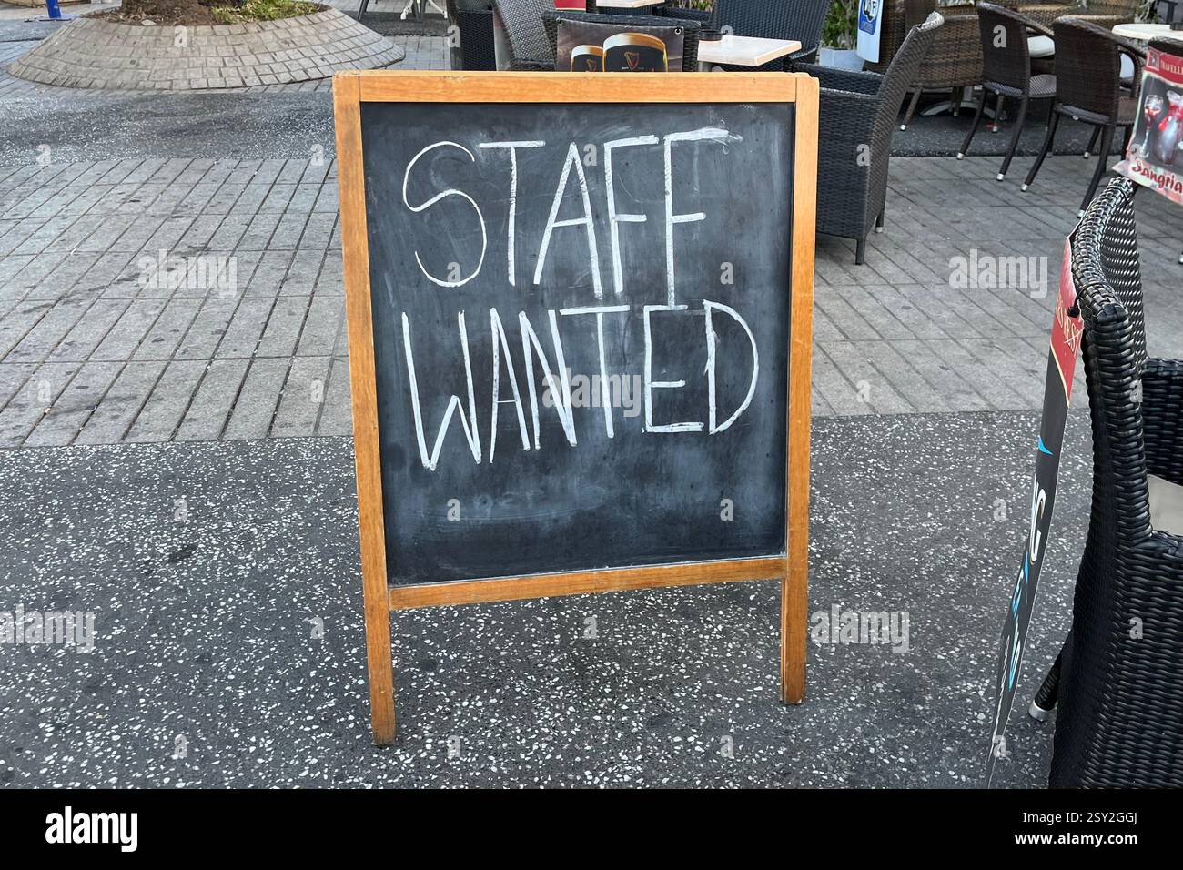 Staff Wanted Sign outside a British Pub called The Travellers Rest. Playa de las Américas, Arona, Tenerife, Canary Islands, Spain. 15th January 2025. - Smartphone Captured Stock Image