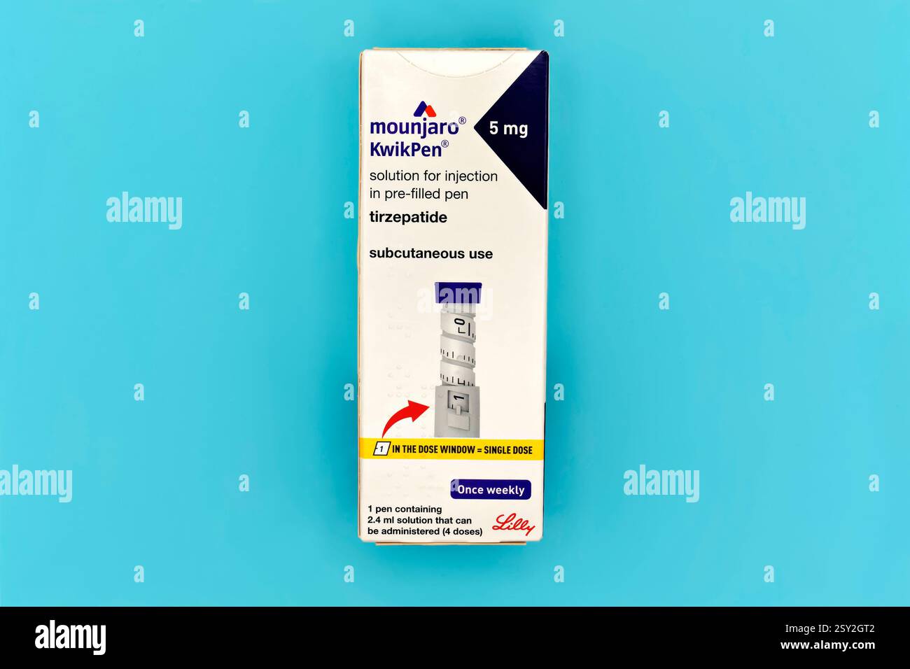 An unopened Mounjaro 5mg KwikPen box on a plain blue background Stock Photo