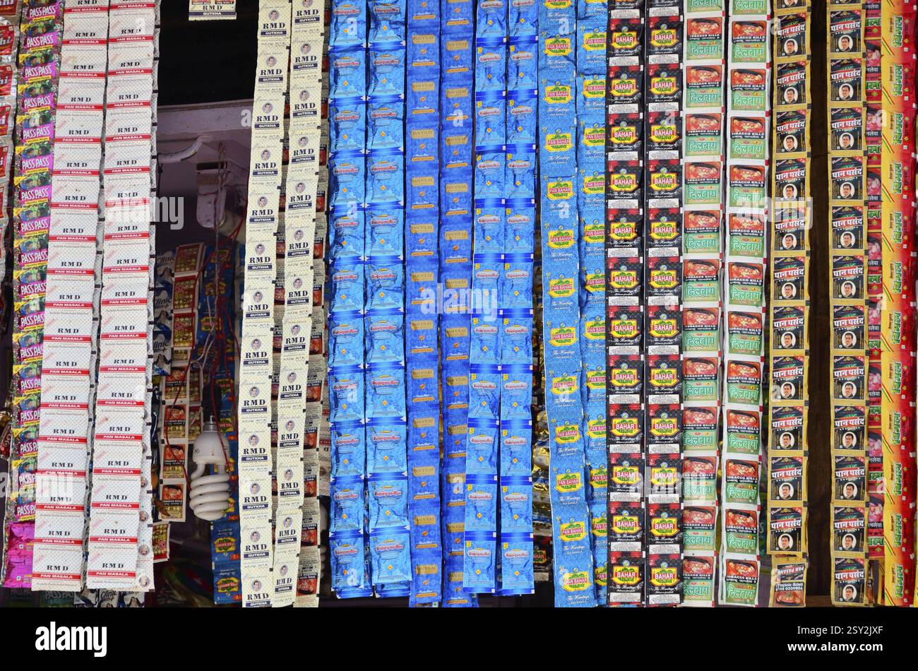 Tobacco pouches in a shop in india hi-res stock photography and images