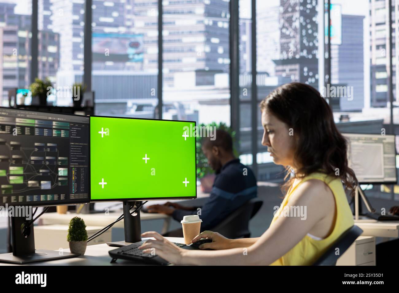 Scientist working with machine learning tech on green screen computer, advancing AI innovating autonomous systems. IT expert in office transforming data into predictive models using mockup PC Stock Photo