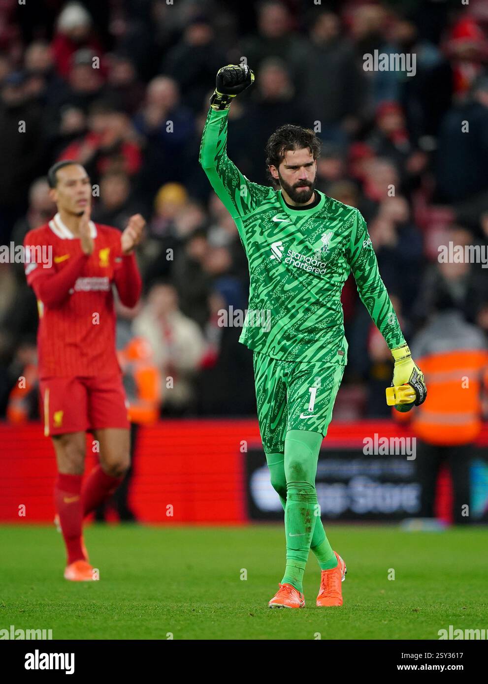 Liverpool goalkeeper Alisson Becker salutes the fans after the Premier ...