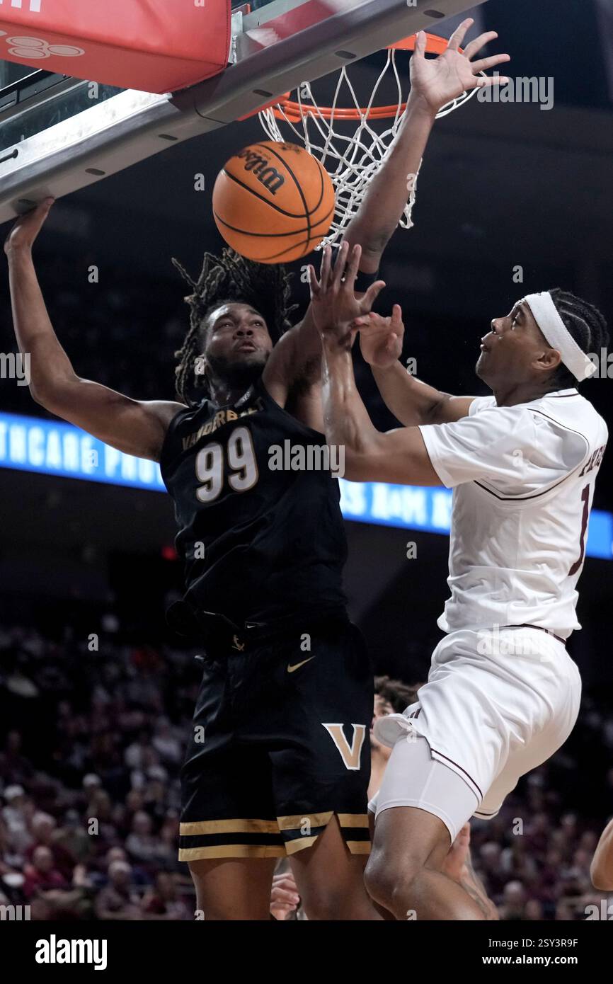 Devin Forward Vanderbilt forward Devin McGlockton (99) blocks a shot attempt by Texas ...