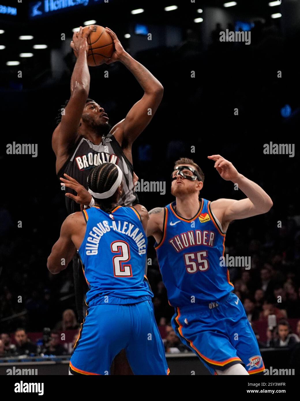 Brooklyn Nets' Day'Ron Sharpe shoots over Oklahoma City Thunder's Shai ...
