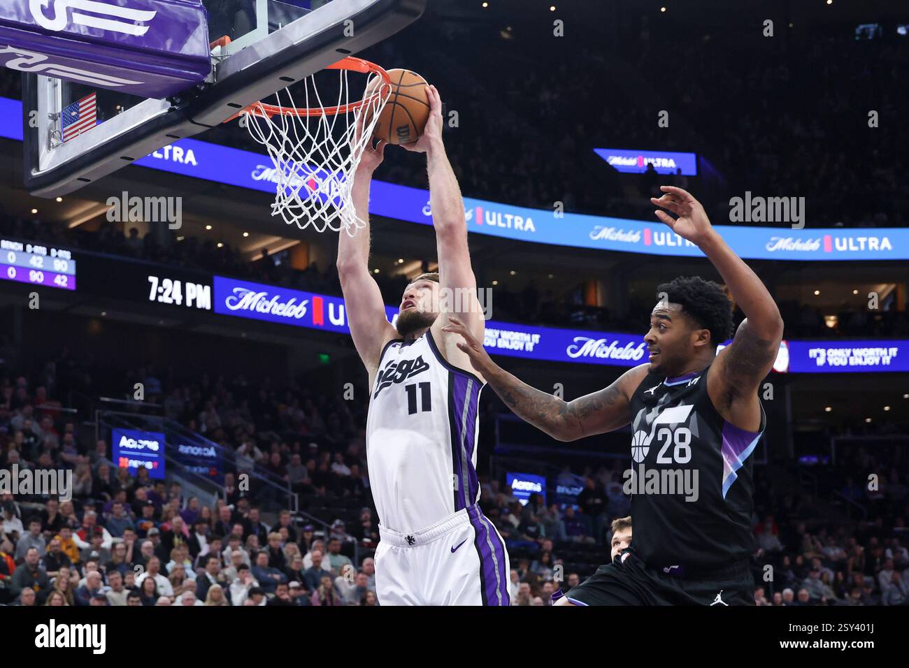 Sacramento Kings forward Domantas Sabonis (11) dunks against Utah Jazz forward Brice Sensabaugh