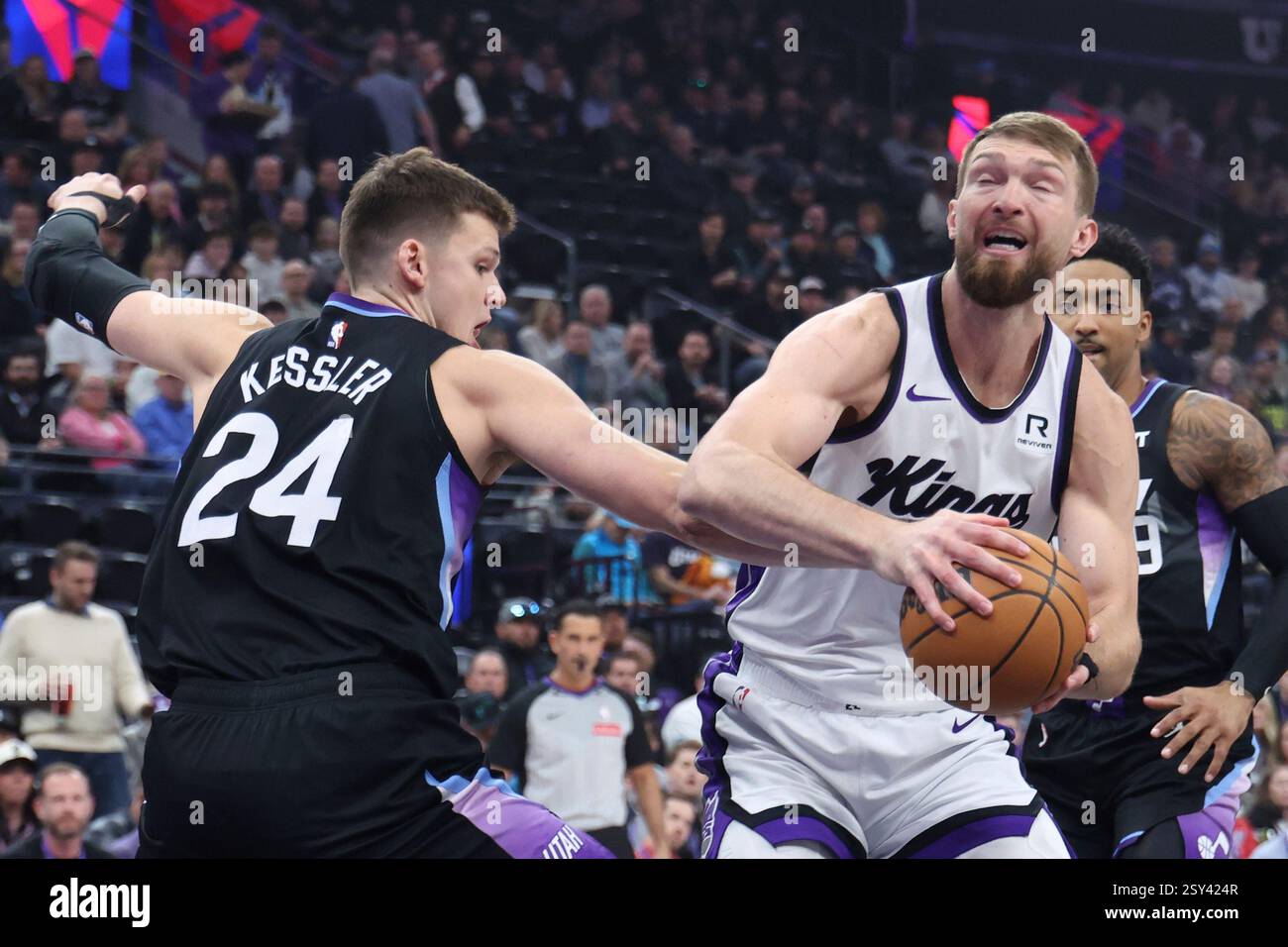 Sacramento Kings forward Domantas Sabonis, right, goes to the basket against Utah Jazz center