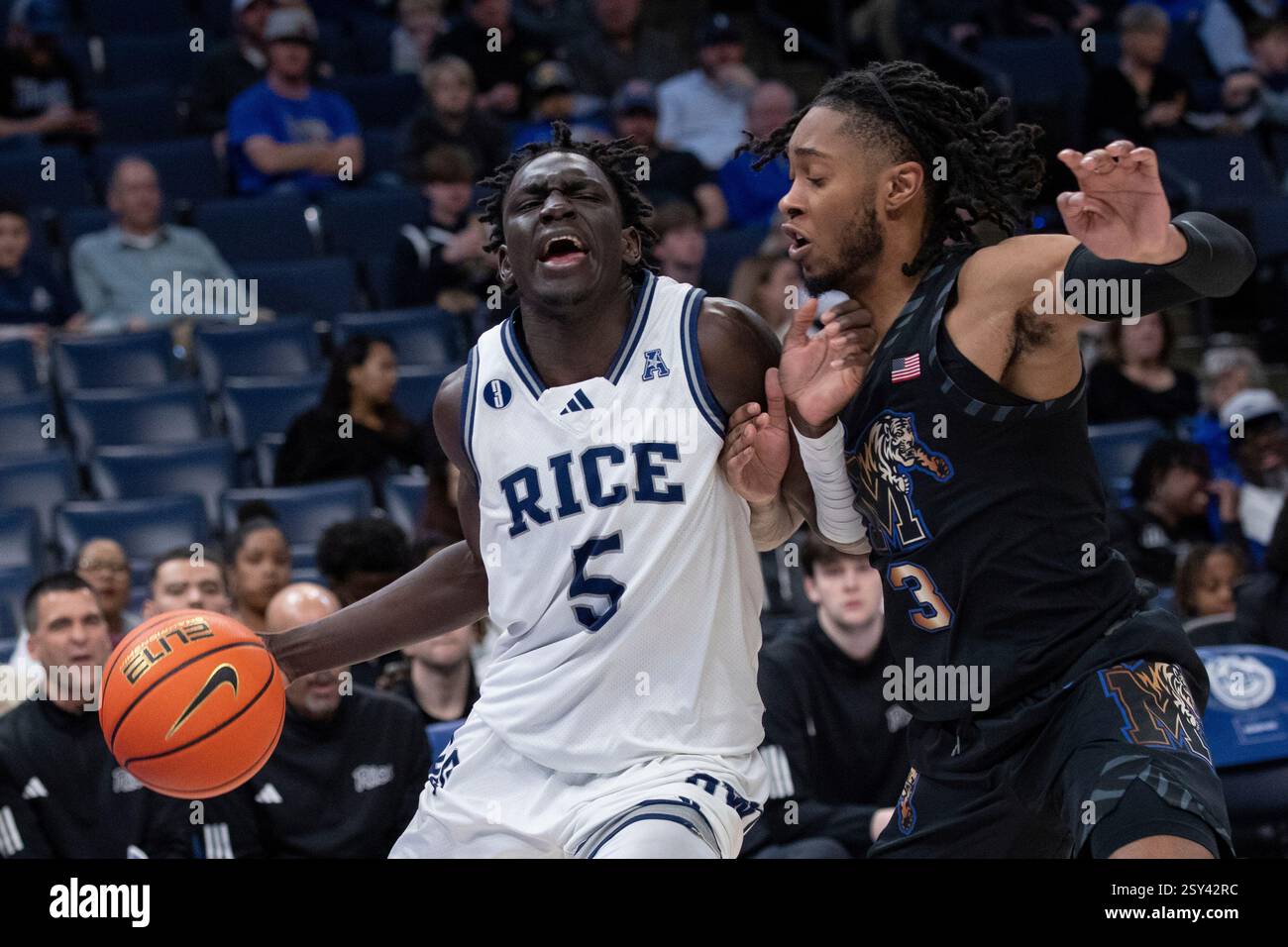 Rice guard Jacob Dar (5) drives with the ball defended by Memphis guard ...