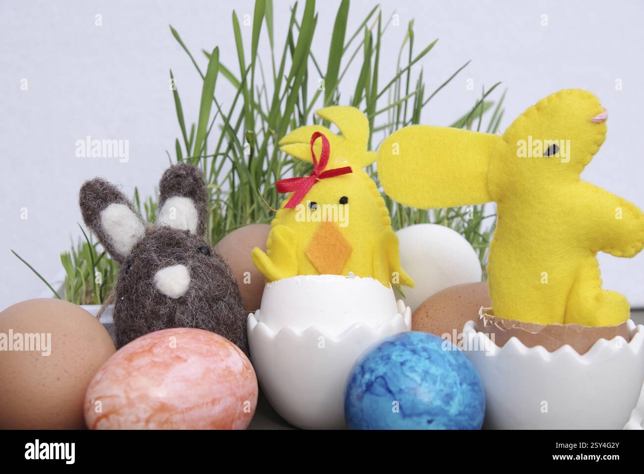 Easter, Easter decoration, Easter egg, Easter bunny, colourful, Coloured eggs and figures lie decorated on a table Stock Photo
