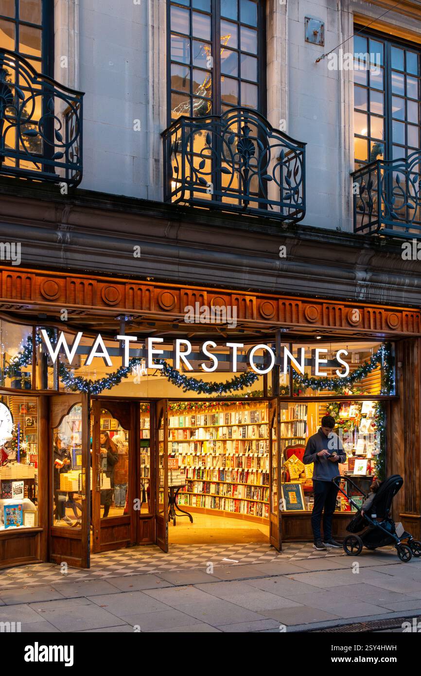 Shoppers in Cambridge town centre in the early evening at Christmas. England, UK Stock Photo
