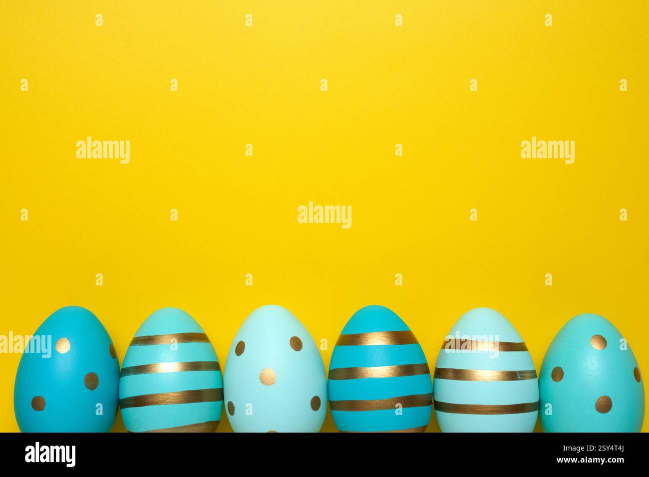 Empty yellow background with Easter eggs Stock Photo