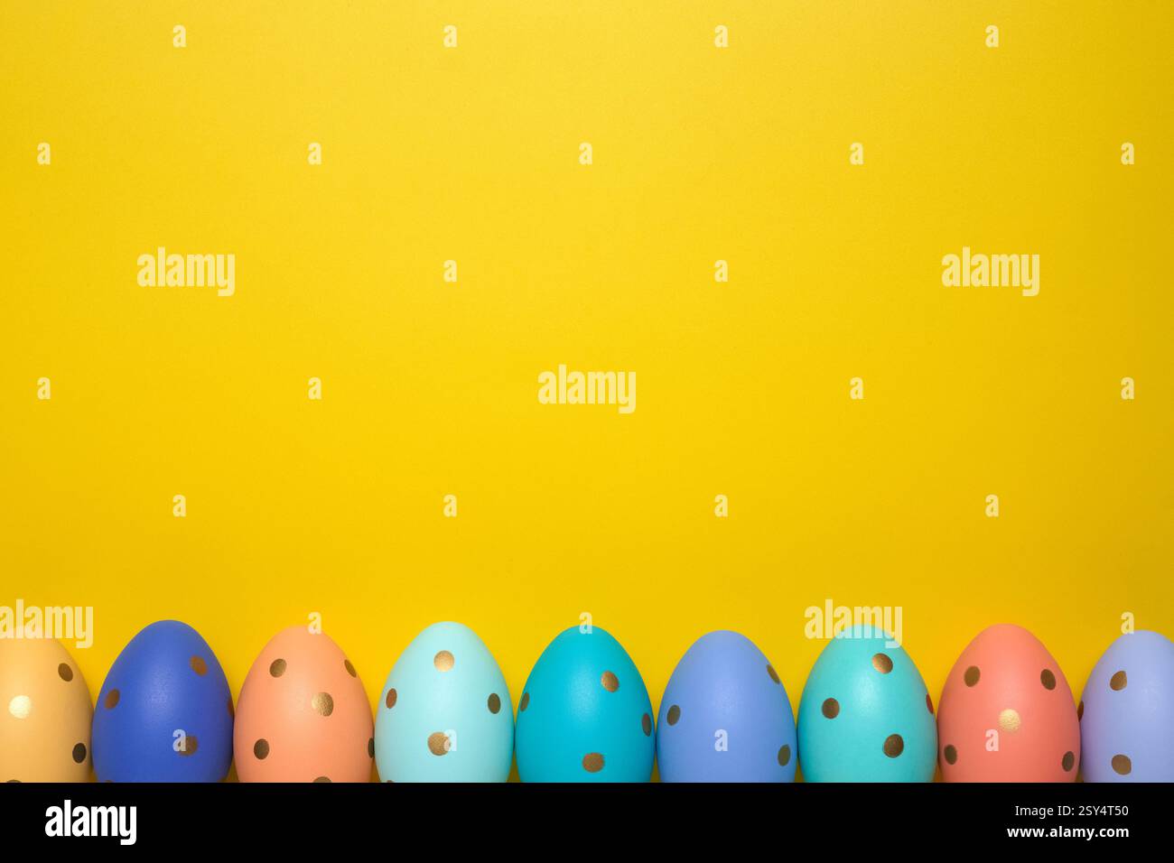 Empty yellow background with Easter eggs Stock Photo