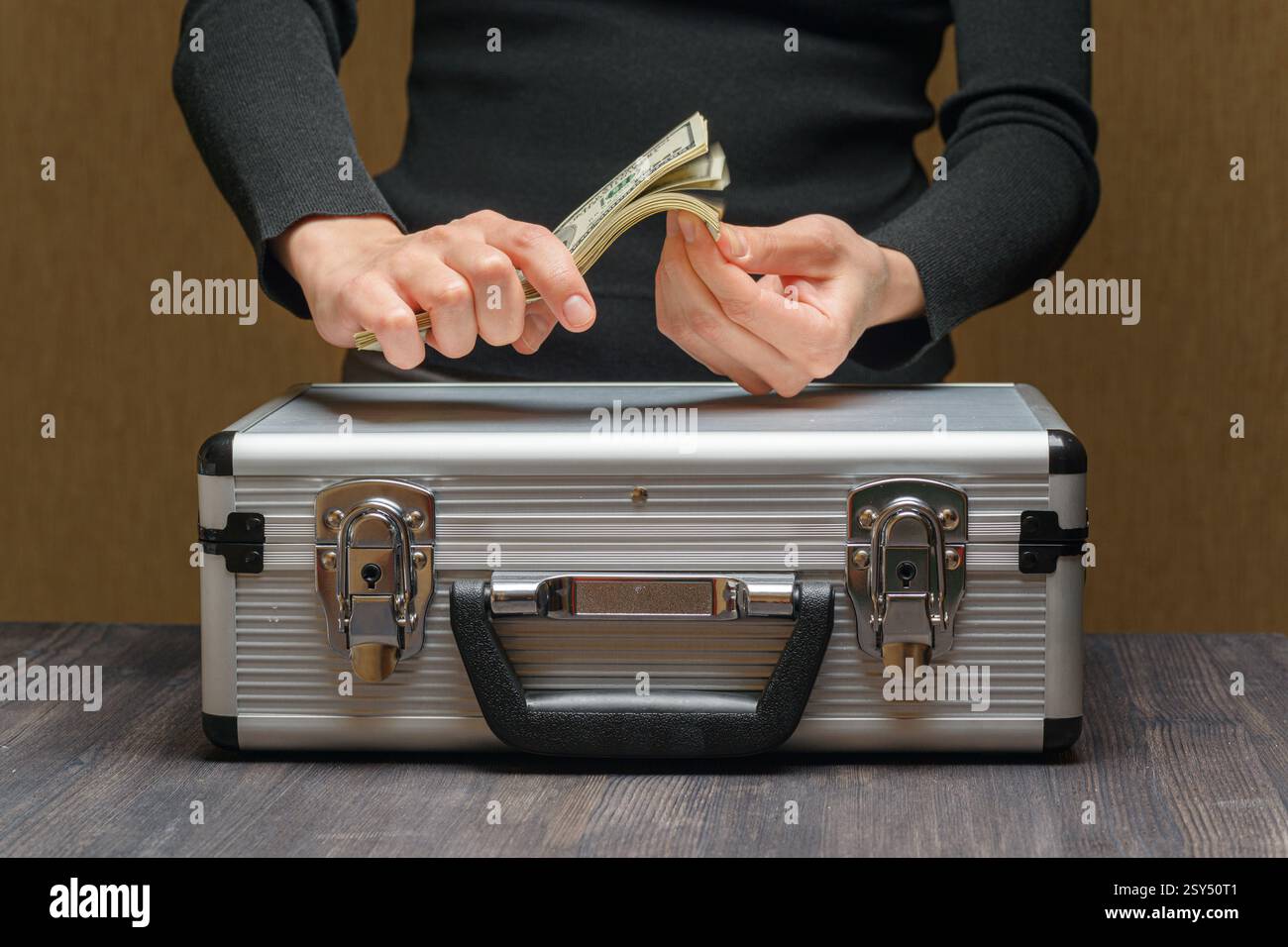 Closeup view of money case and female hands counting cash Stock Photo ...