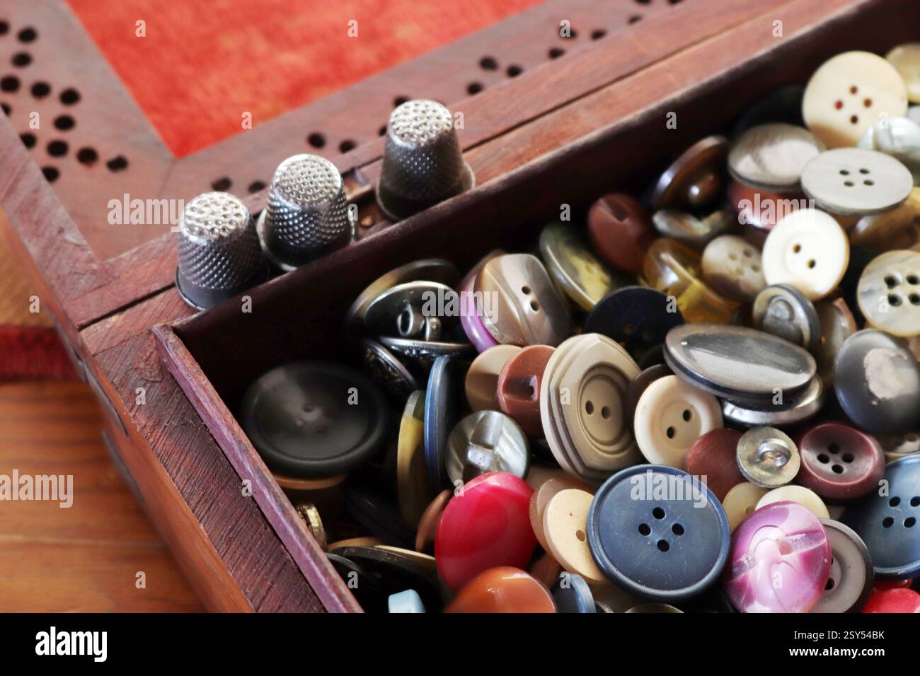many old buttons are in a box Stock Photo