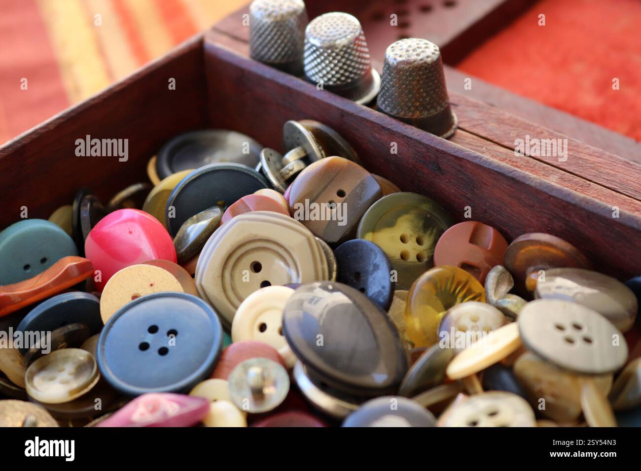 many old buttons are in a box Stock Photo