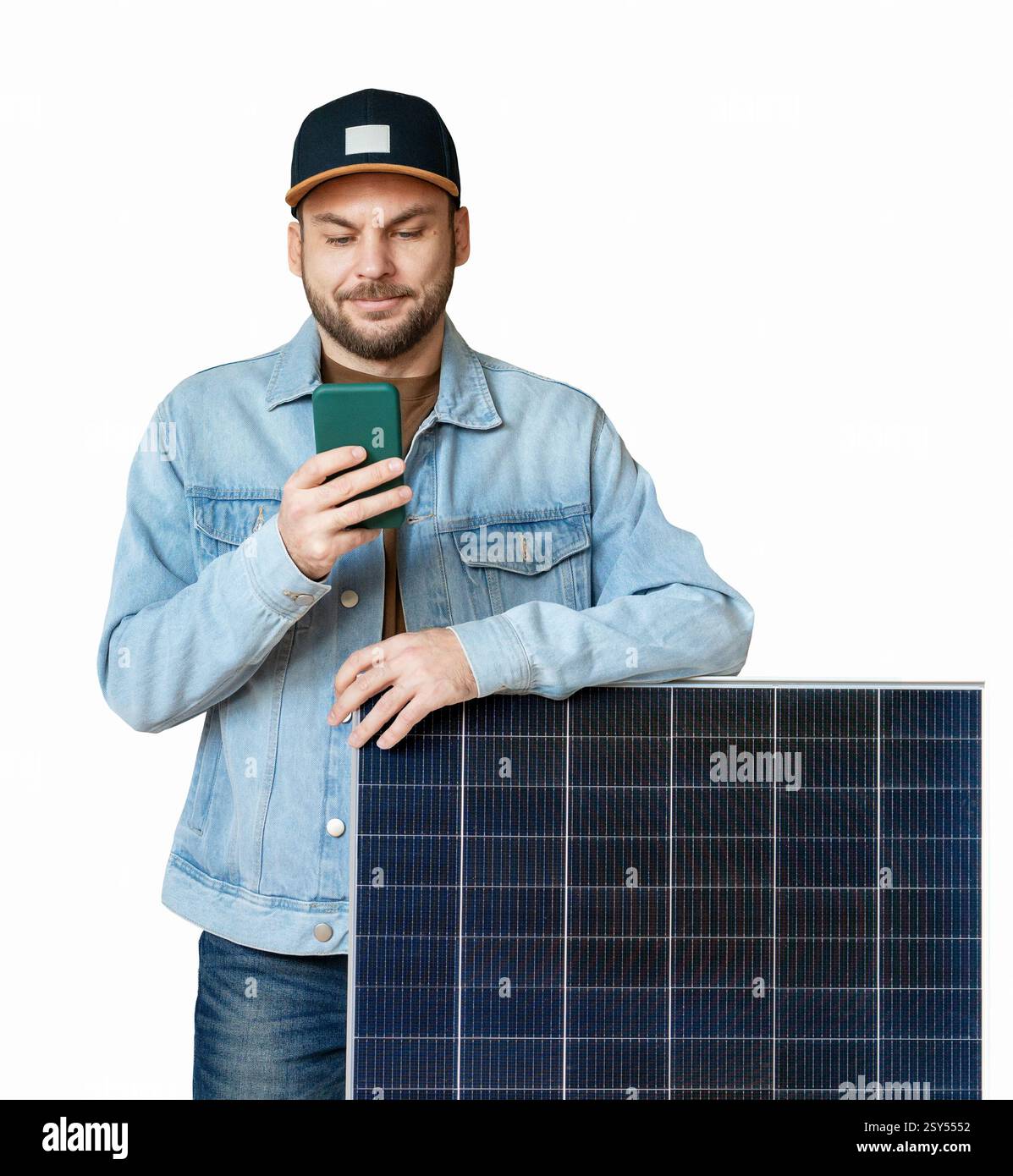 Isolated modern man standing next to solar panel and using his smart phone Stock Photo