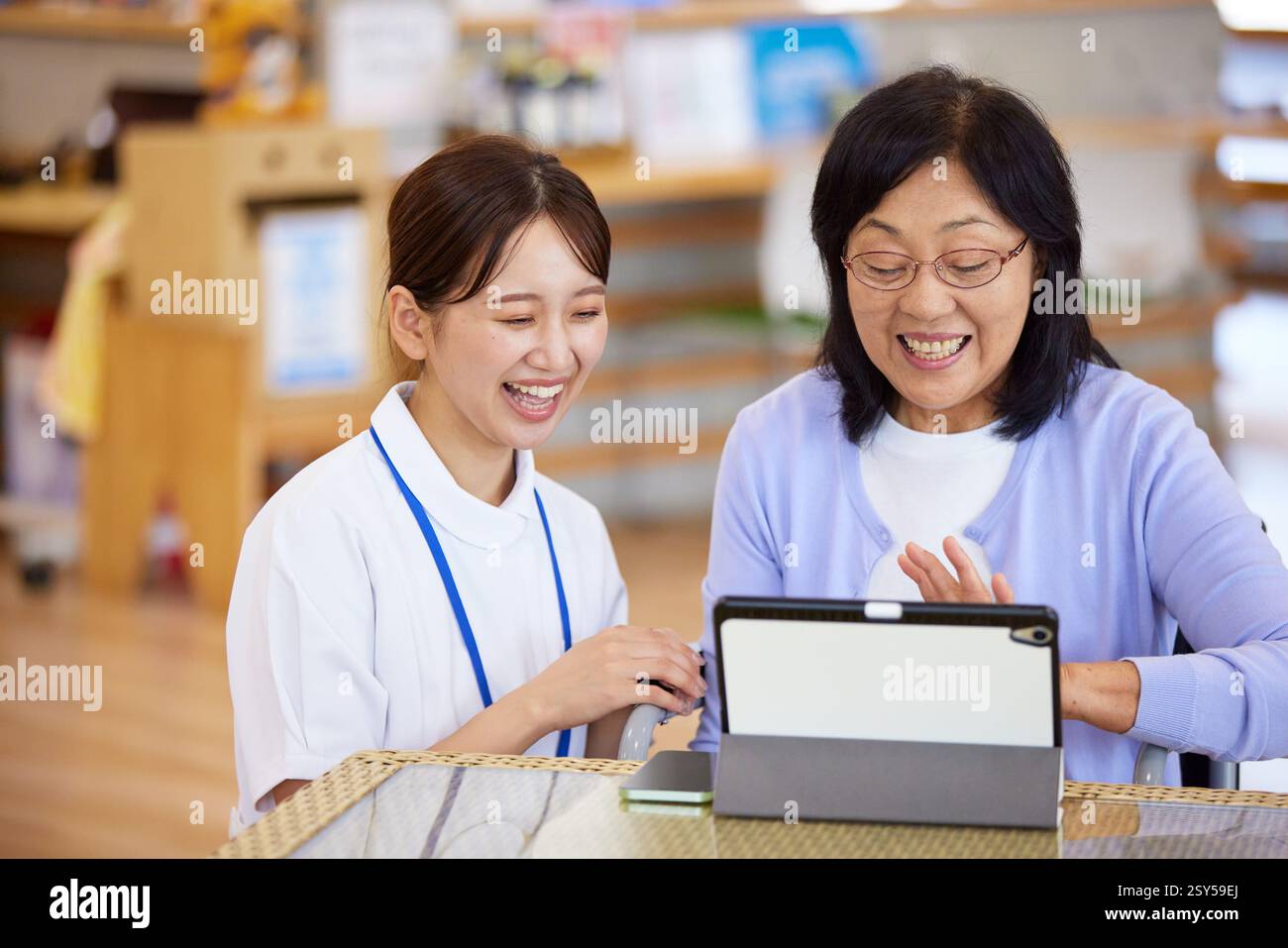 Asian woman caregiver using digital hi-res stock photography and images ...