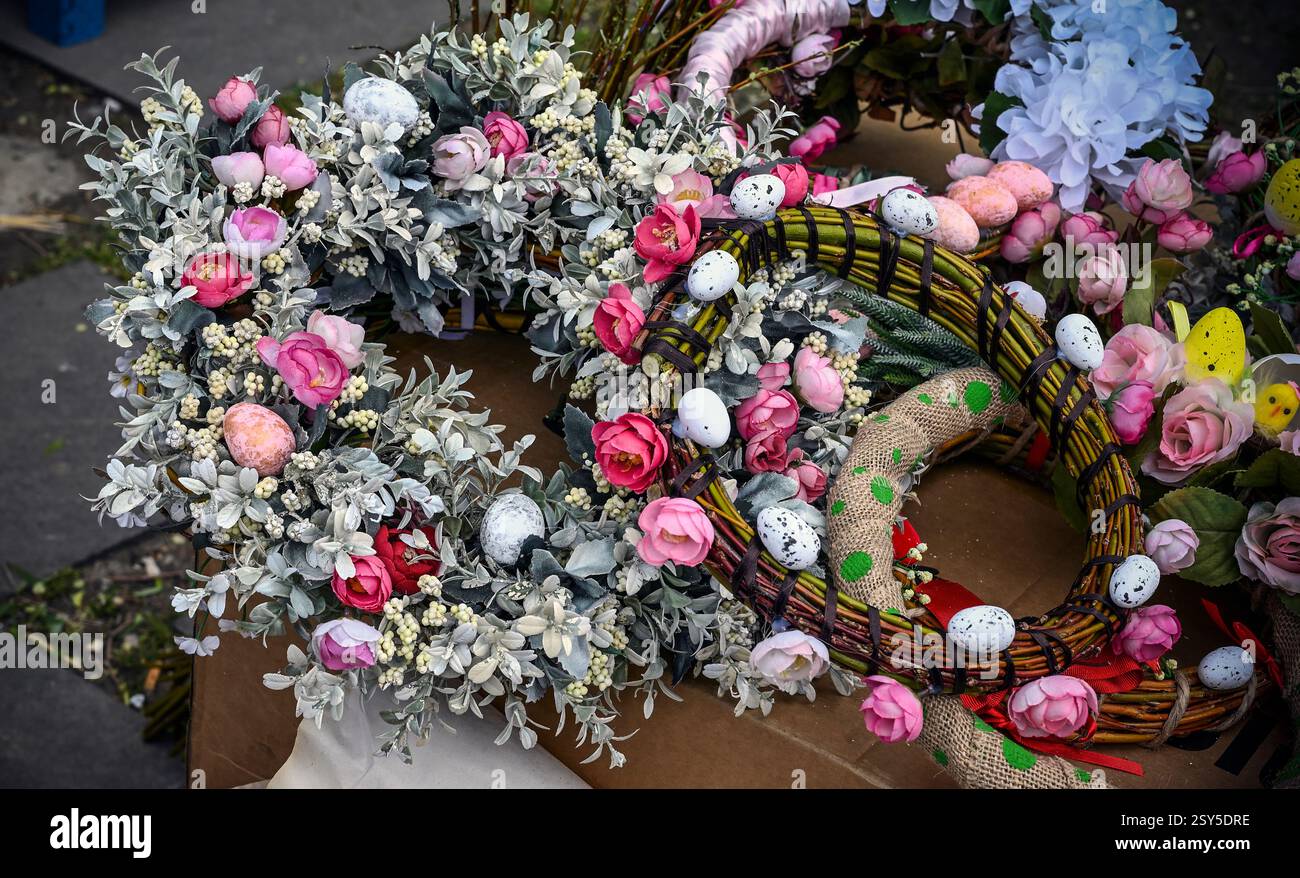 Decorative Easter garlands with flowers and painted eggs Stock Photo