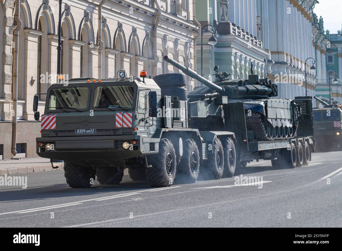 SAINT PETERSBURG, RUSSIA - APRIL 28, 2022: Heavy transporter of BAZ-6403 carries a tank of T-72B3. Preparations for the military parade in honor of Vi Stock Photo