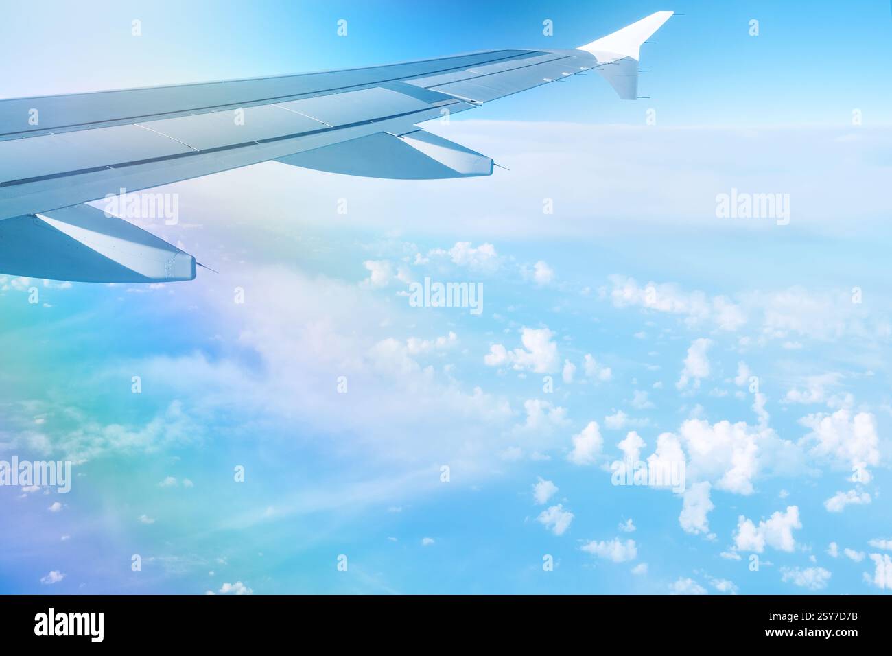 Clouds and sky as seen through window of airplane. View from airplane ...
