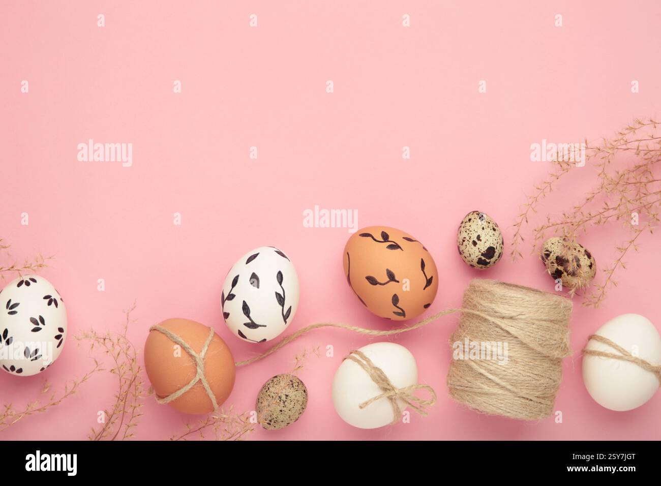 Composition with Easter eggs on pink background. Space for text Stock Photo