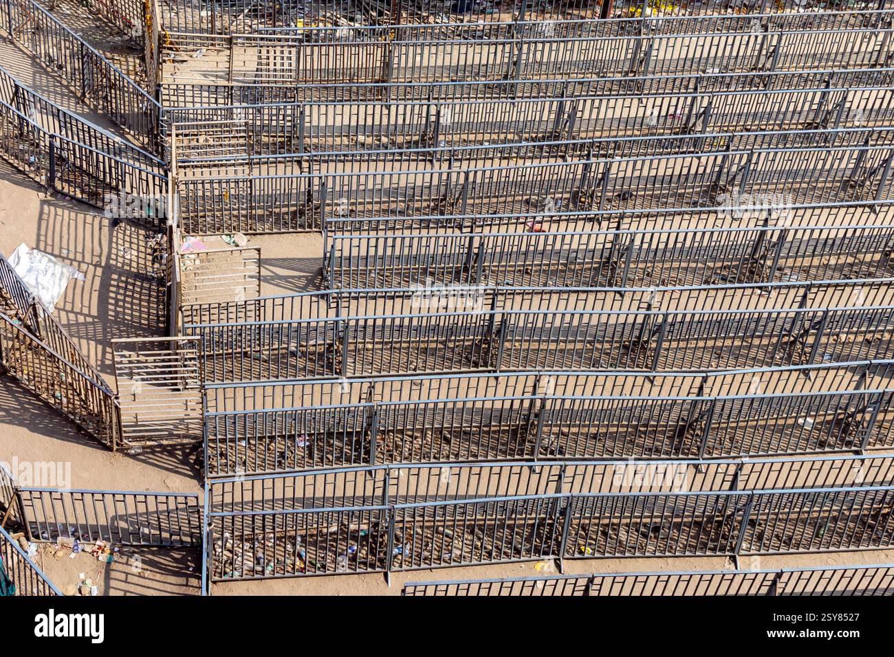 empty iron barricade for temple queue management during daytime Stock Photo