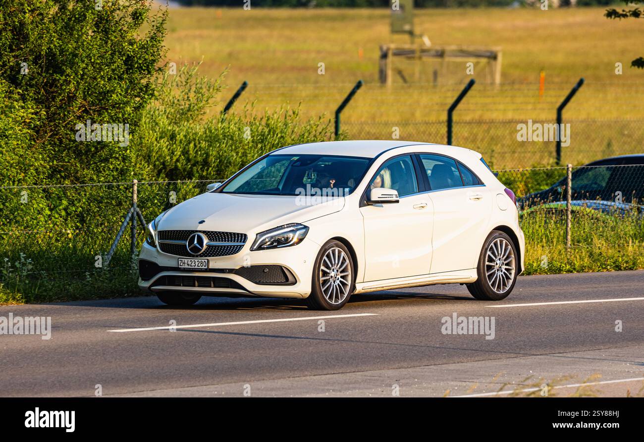 Oberglatt, Switzerland, 6th Jun 2023: A Mercedes-Benz A-Class, series 176, is driving on a road outside the Zurich lowlands, (Photo by Andreas Haas/di Stock Photo