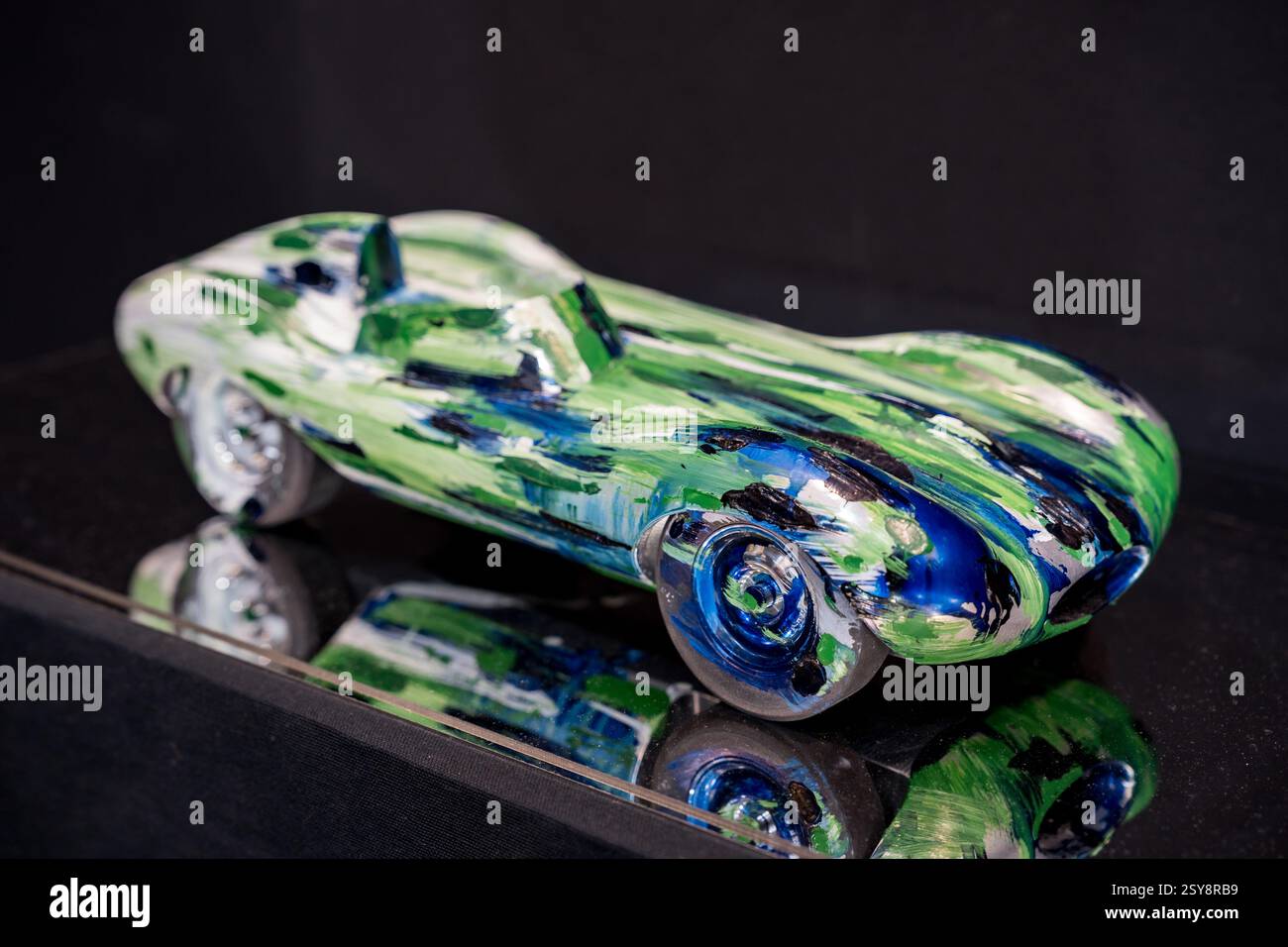 Colorful glass sculpture of a racing car showcasing artistic flair in a ...