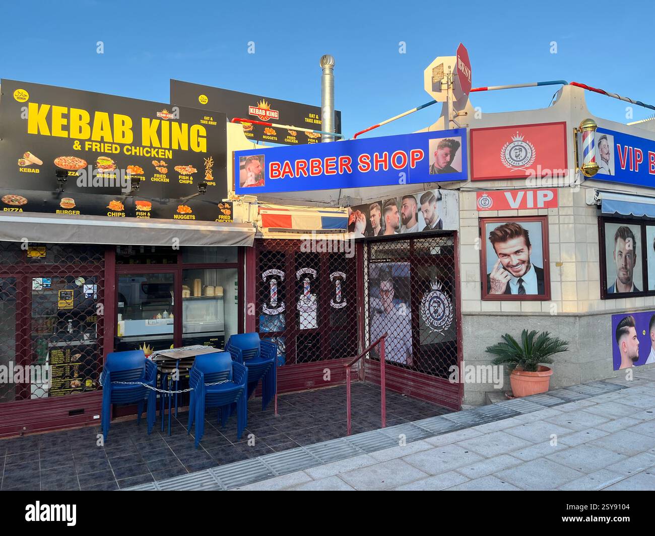 A Kebab Shop called 'Kebab King' and a Barber Shop in Costa Adeje. Tenerife, Canary Islands, Spain. 28th January 2025. - Smartphone Captured Stock Image