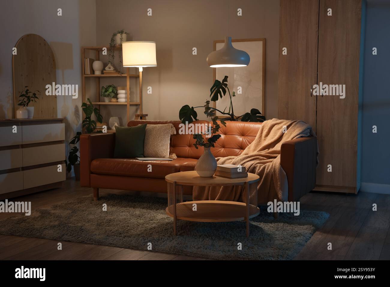 Stylish interior of living room with cozy sofa, coffee table and ...