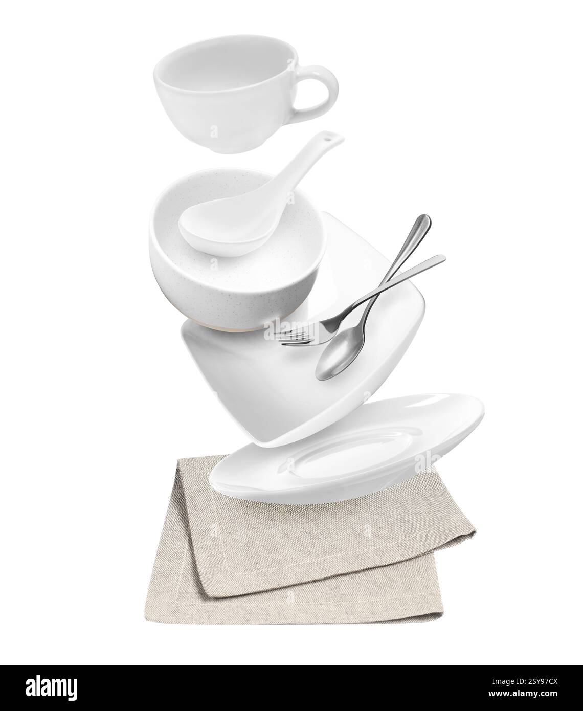 Clean dishware and silverware flying over napkin on white background Stock Photo