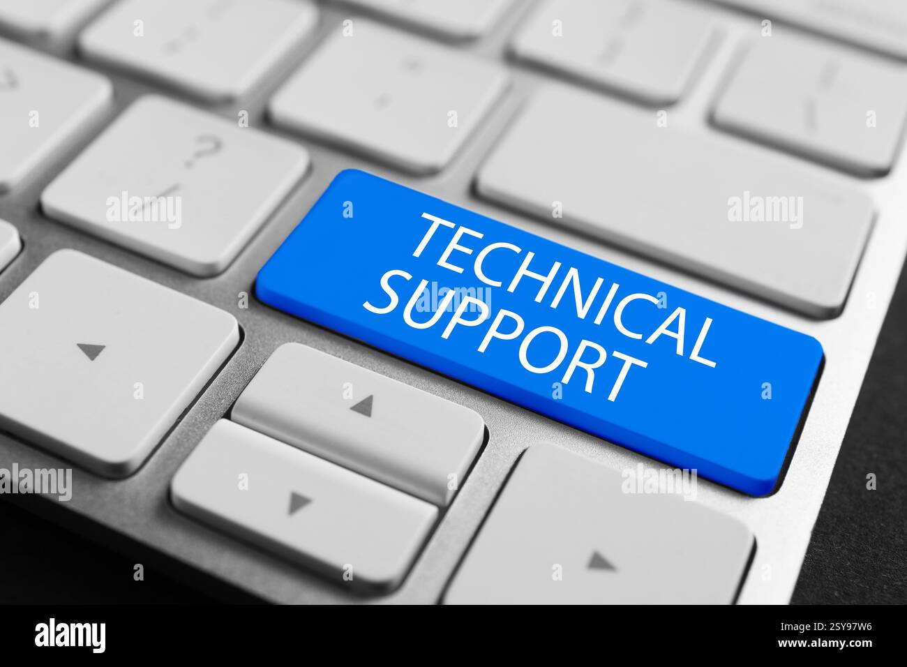 Technical Support button blue on computer keyboard, closeup Stock Photo