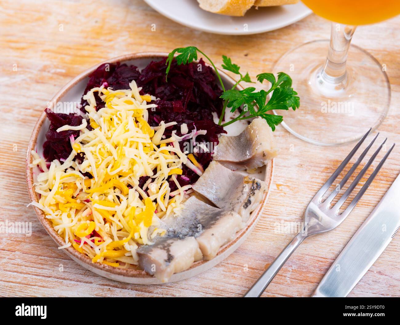 Beetroot served with cheese and pickled mackerel Stock Photo
