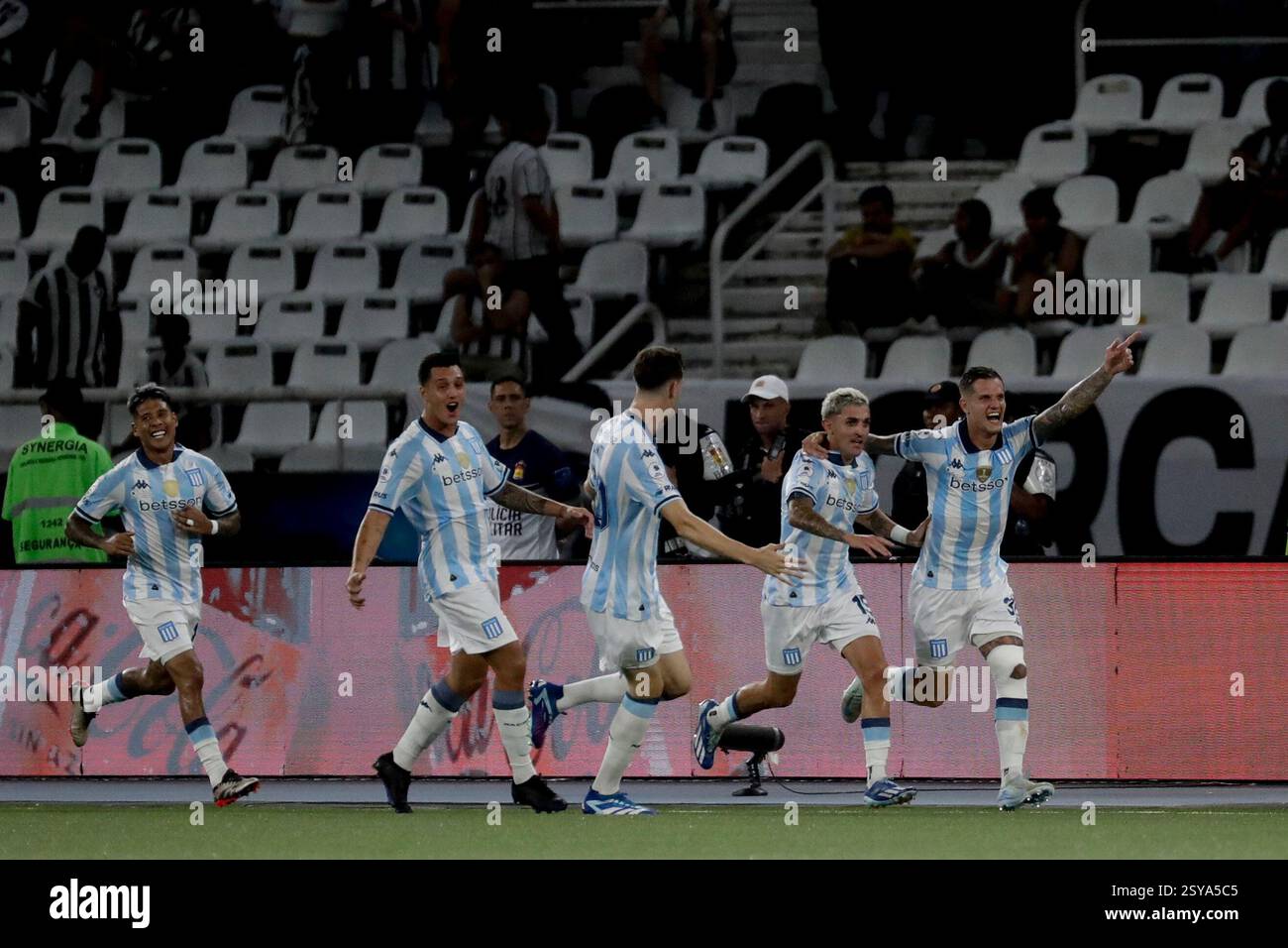 Zucullini Racing Bruno Zuculini of Argentina's Racing Club, right, celebrates with ...
