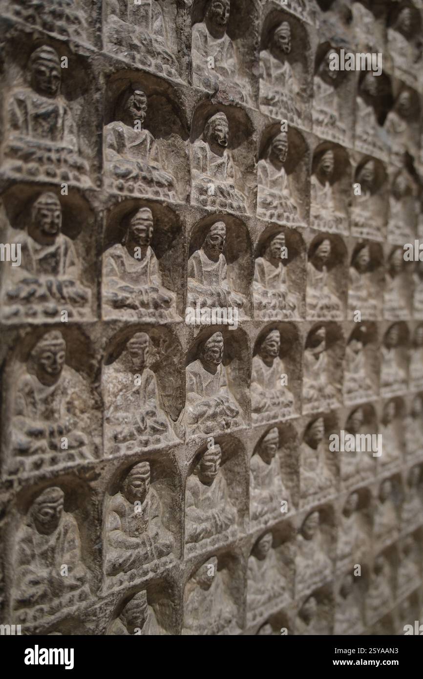 Shanghai,China-March 17th 2024: Thousand buddha votive stele. ancient Buddhism votive stele Stock Photo