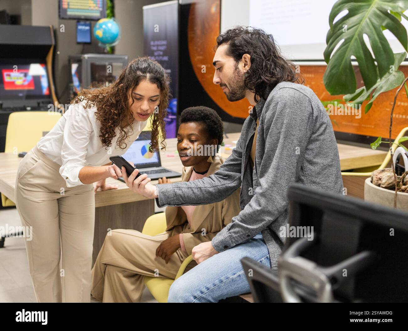 A diverse group of professionals collaborates in a modern office ...