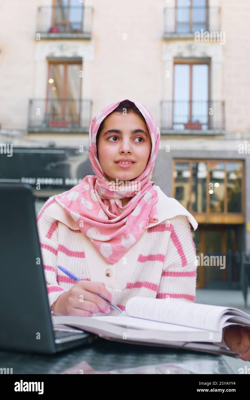 Young woman wearing pink hijab hi-res stock photography and images - Alamy
