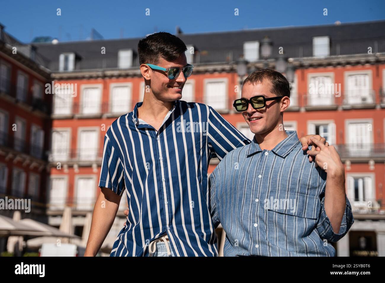 Joyful gay couple walking hi-res stock photography and images - Alamy