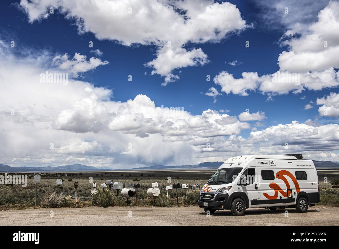 Letterboxes, mailboxes, cumulus clouds Highway 50, Loneliest Road in America, Ely, Nevada, USA, North America Stock Photo
