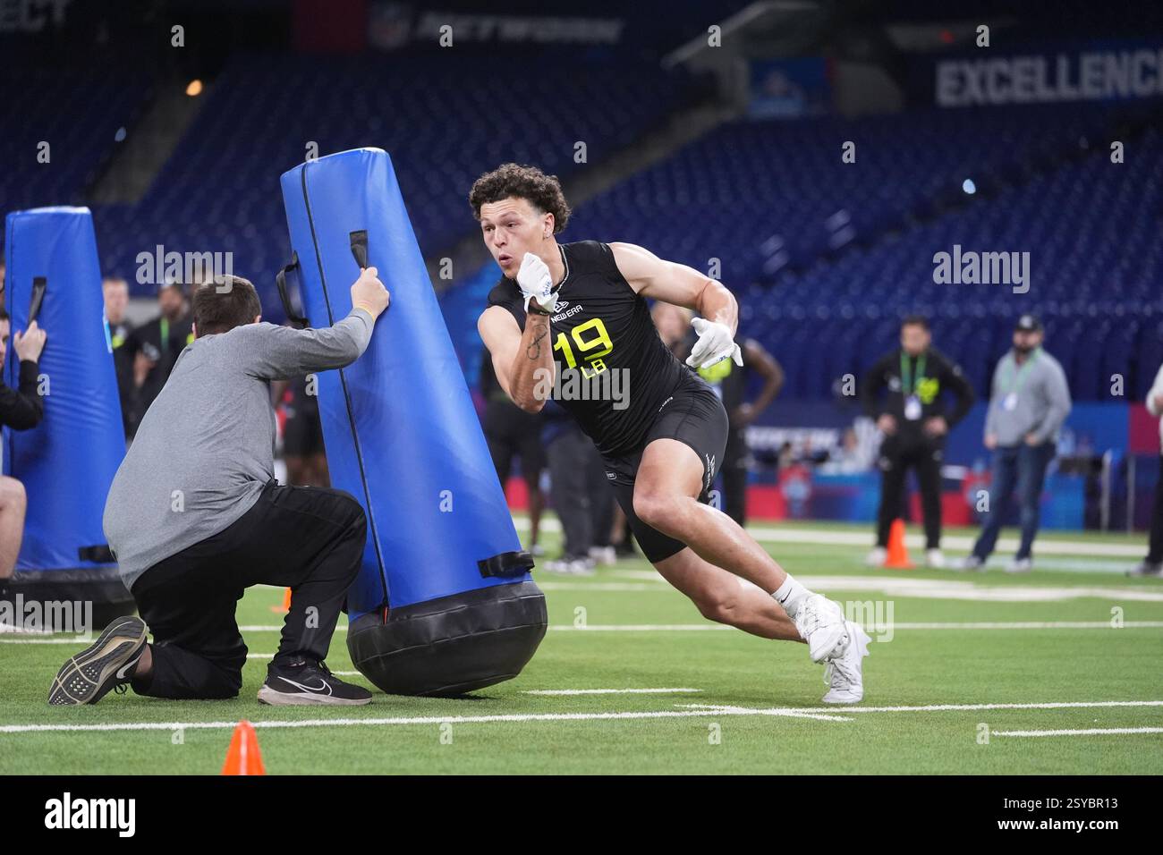 UCLA linebacker Kain Medrano runs a drill at the NFL football scouting ...
