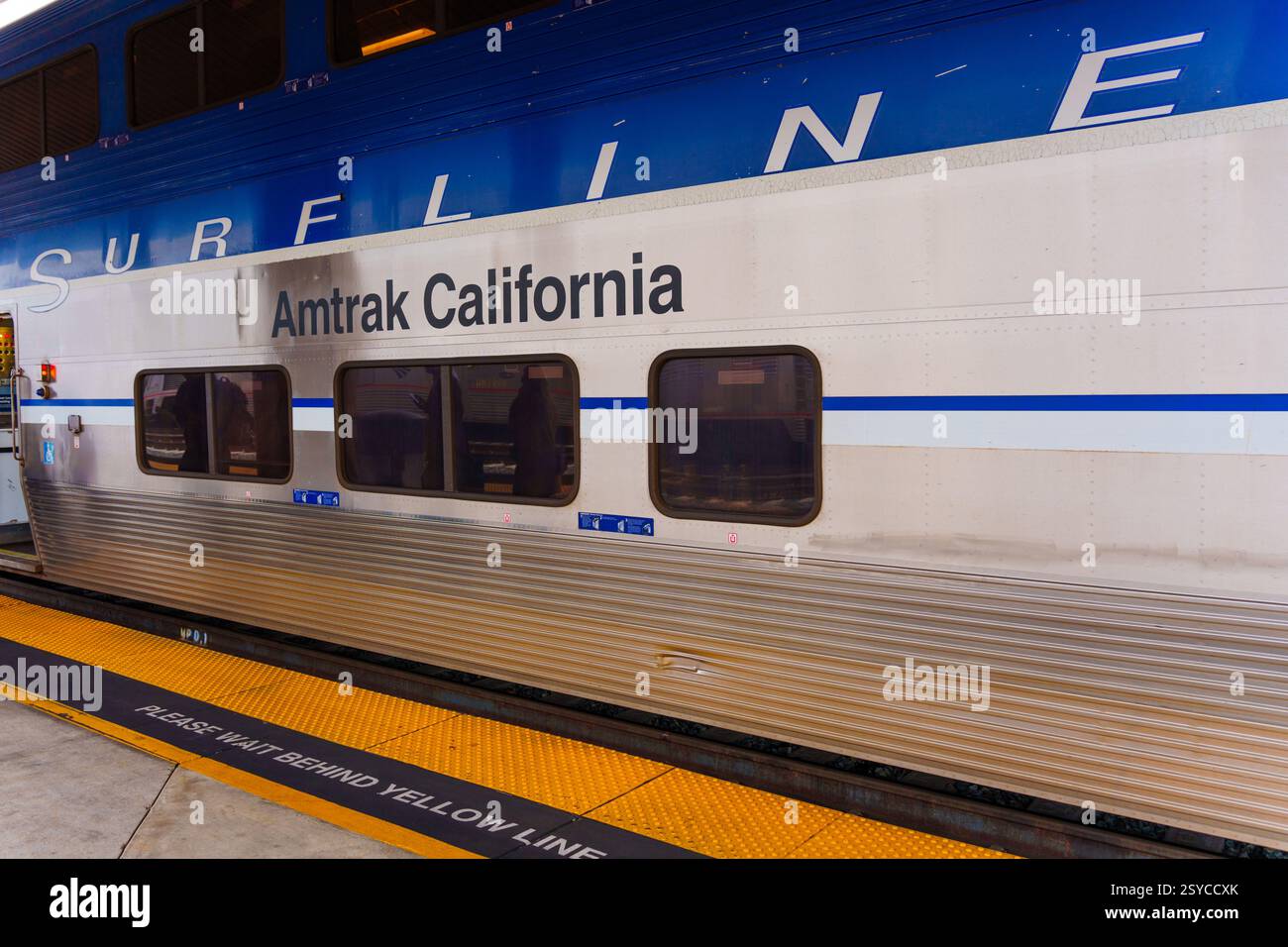 Los Angeles, California - December 30, 2024: Close-up view of an Amtrak California Surfline train car, showcasing its sleek design and a warning for p Stock Photo