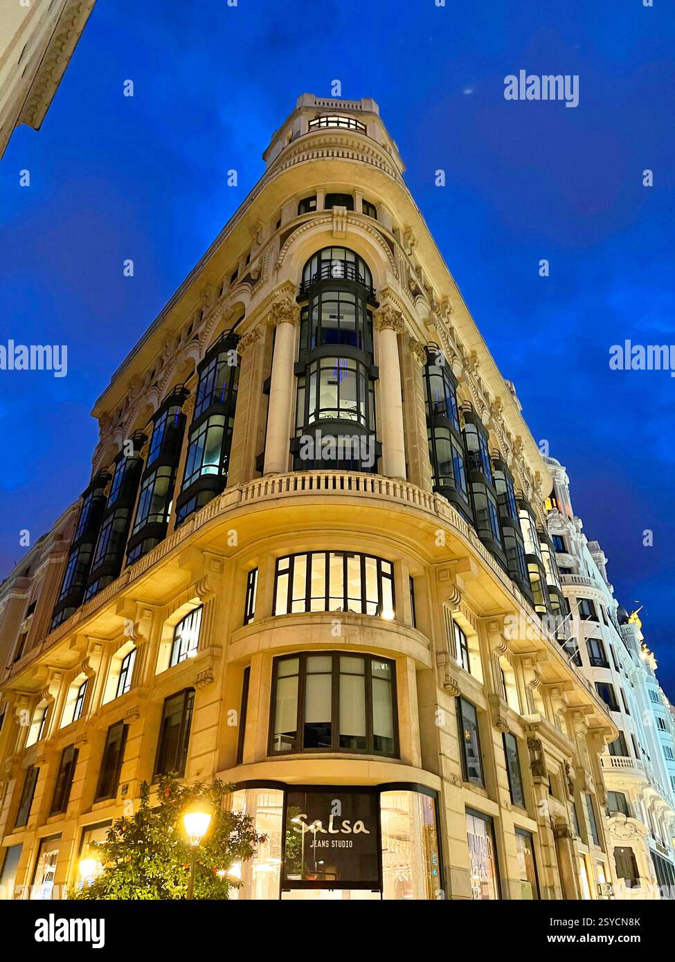 Matesanz building, night view. Gran Via street, Madrid, Spain. - Smartphone Captured Stock Image