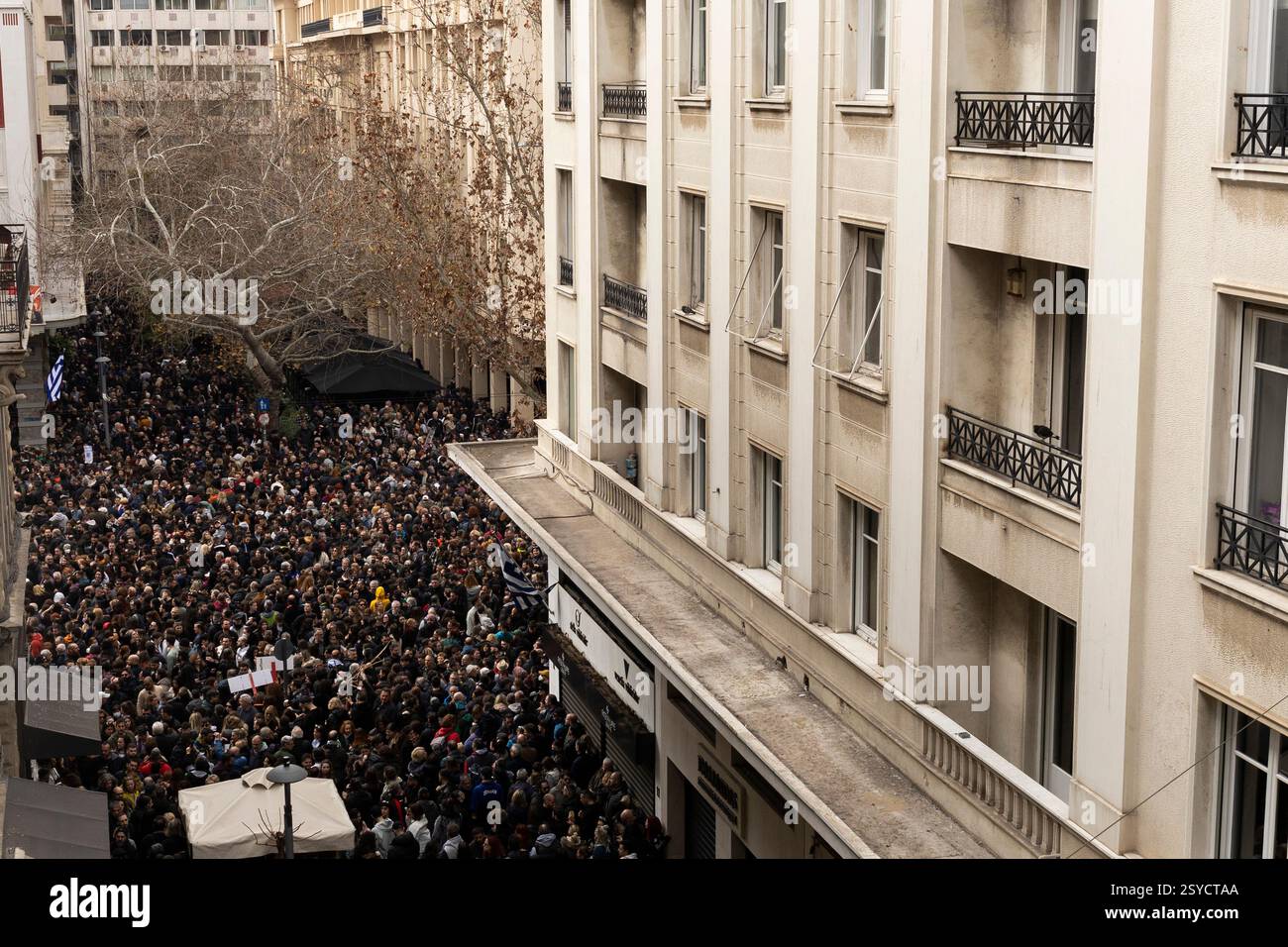 28 February 2025, Greece, Ath: Participants in a demonstration gather ...