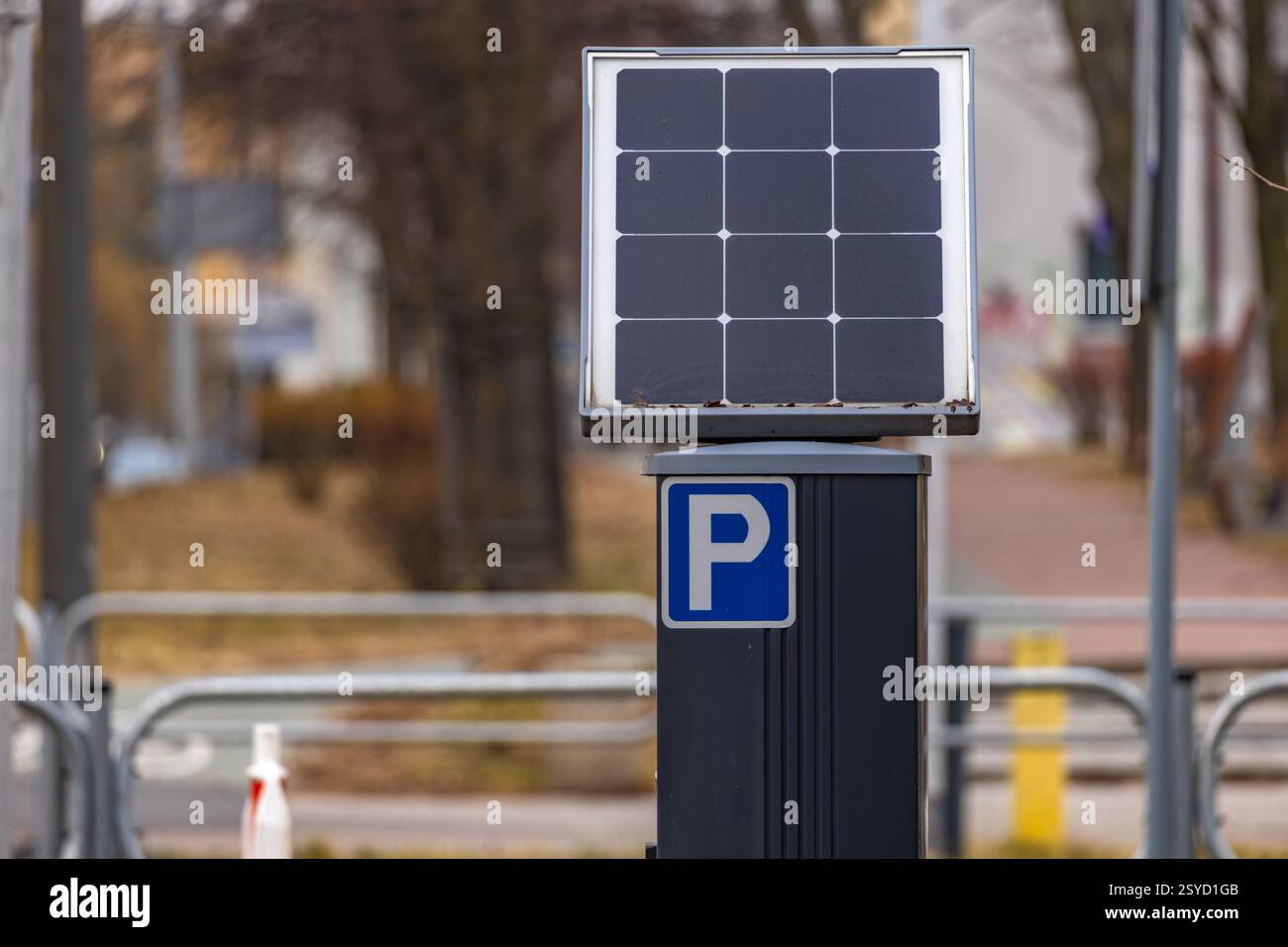 Parking meter for collecting parking fees in the center of an urban agglomeration, photovoltaic panel, parking zone Stock Photo