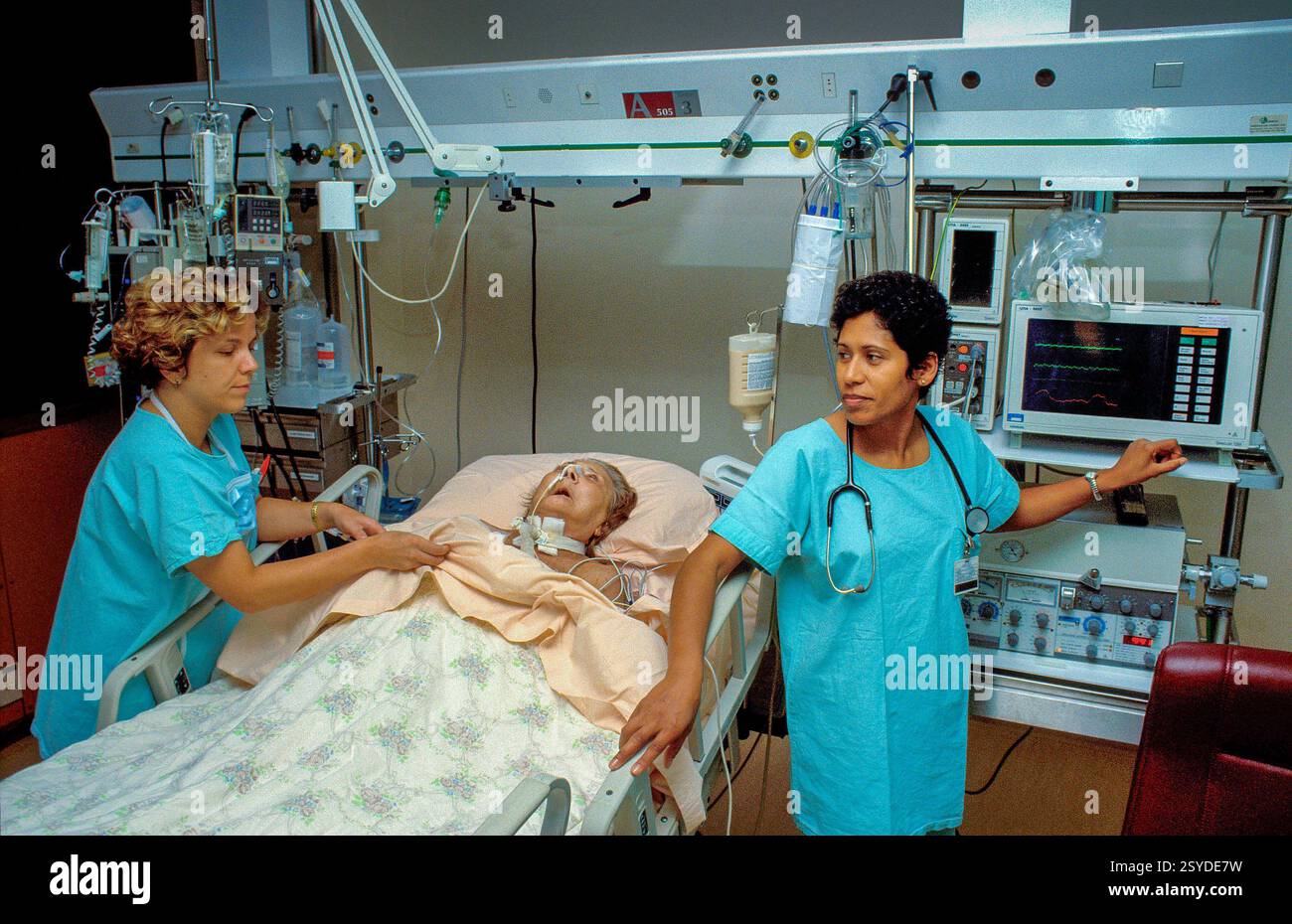Brazil, Sao Paulo. Nurses provide terminal care to a patient. Stock Photo