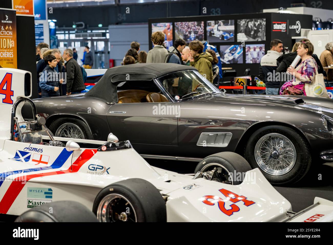 Vintage elegance meets racing spirit at an auto exhibition showcasing a ...