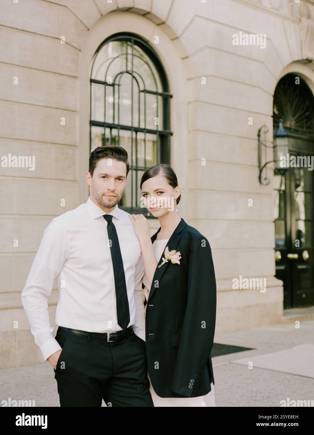 Well dressed couple stands outside hi-res stock photography and images ...