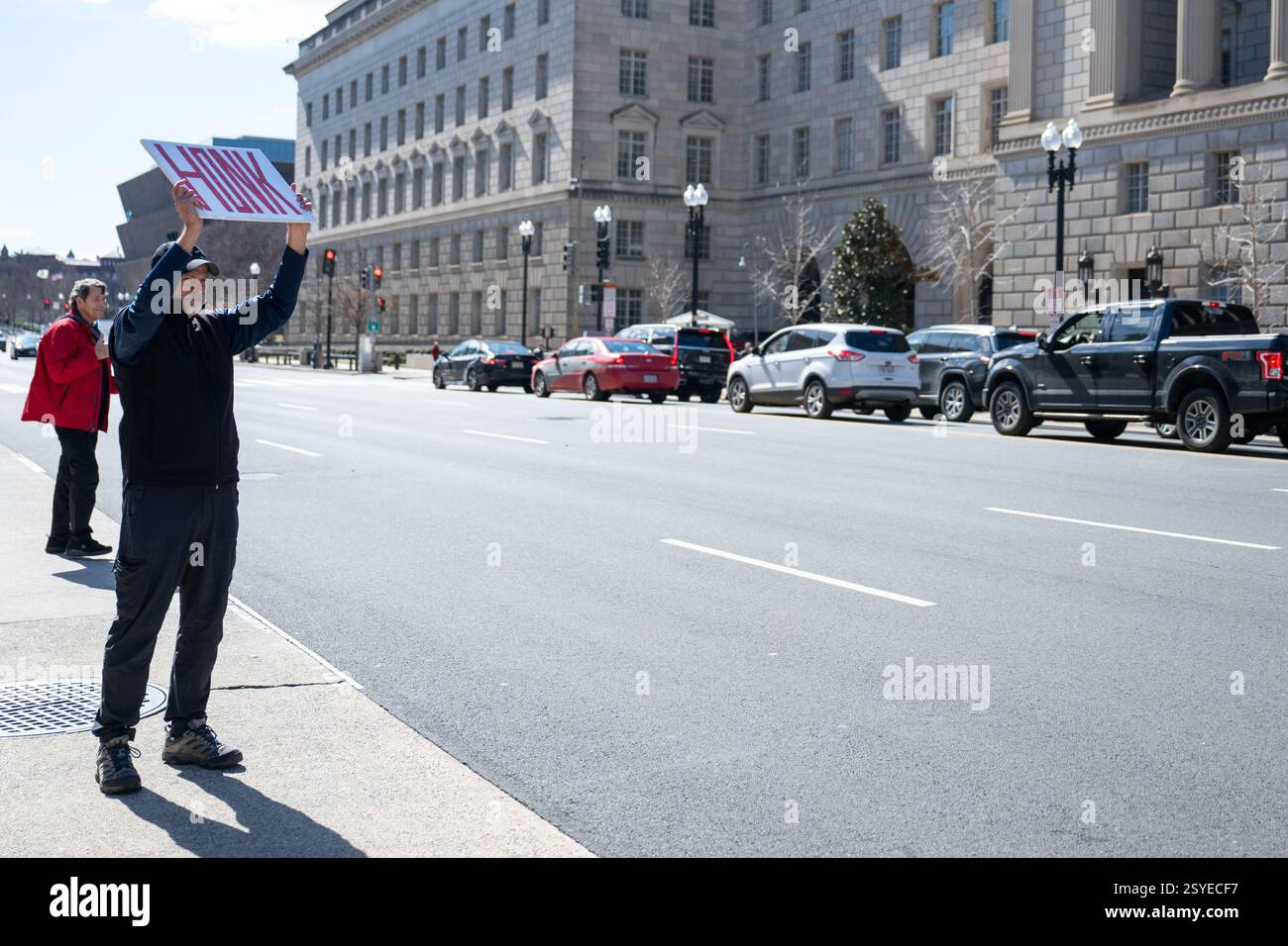 Washington, United States. 28th Feb, 2025. Cars passing honk in support ...